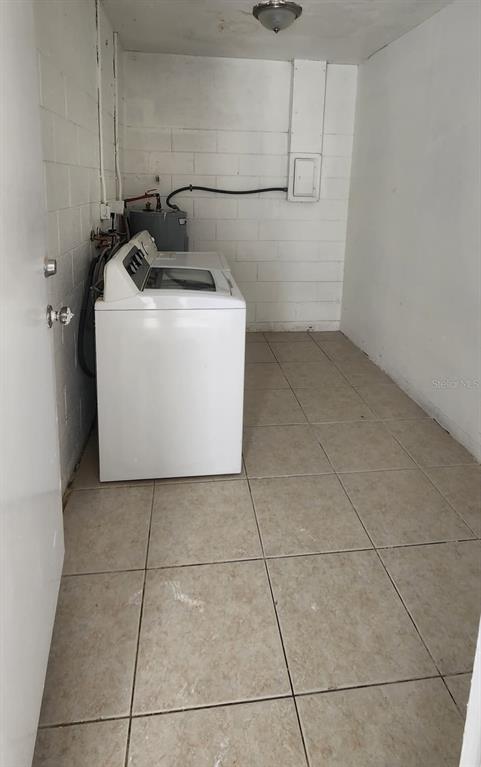 7118 Jenner Avenue New Port Richey, FL 34655 - Photo 11 of 12 a utility room with dryer and washer