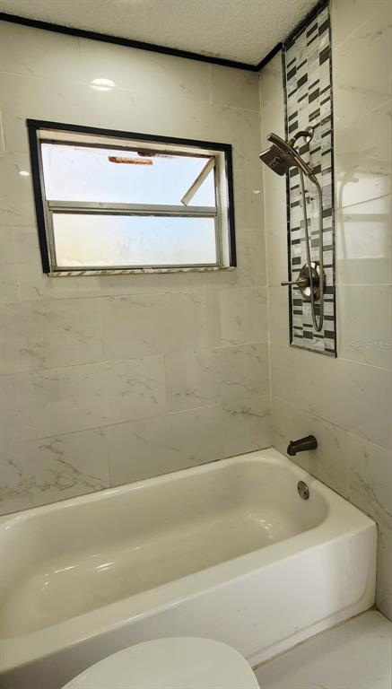 7118 Jenner Avenue New Port Richey, FL 34655 - Photo 6 of 12 a bathroom with a bathtub