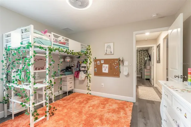 a view of livingroom with furniture and fan
