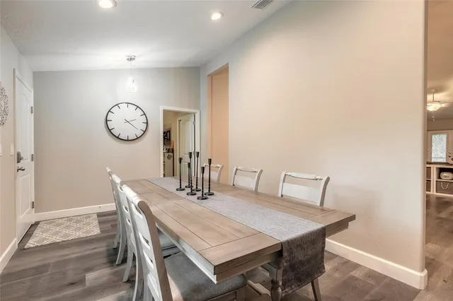 a view of a dining area with furniture and wooden floor
