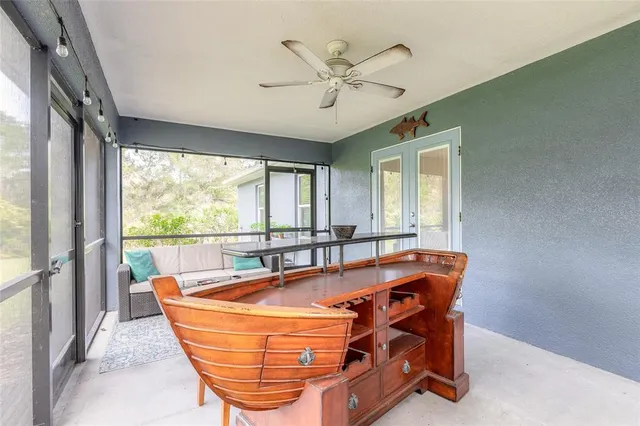a dining room with furniture window and outside view
