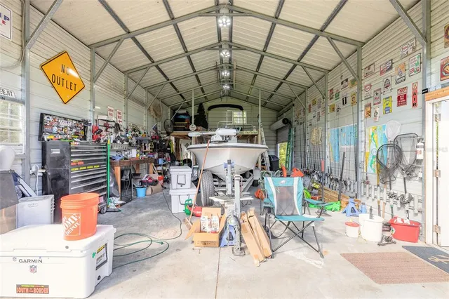 a view of gym equipment with racks on the wall