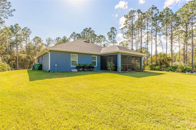 a house that has a swimming pool in front of it