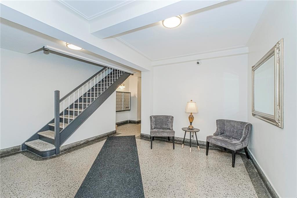 20 89th Street, Unit 3A Brooklyn, NY 11209 - Photo 14 of 18 a living room with furniture and a rug