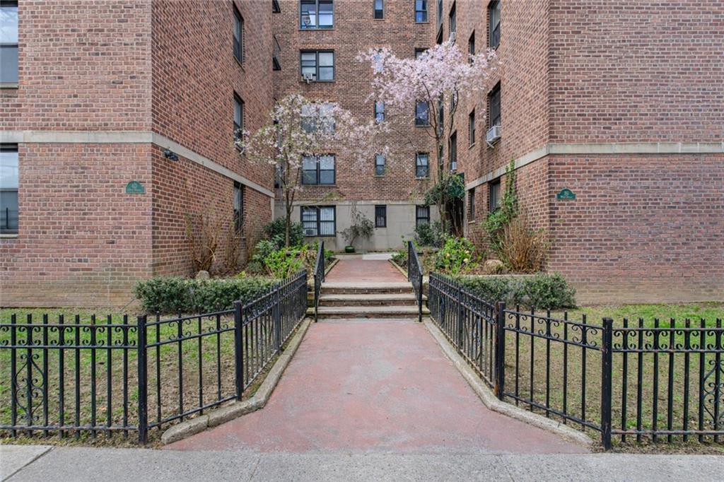 20 89th Street, Unit 3A Brooklyn, NY 11209 - Photo 16 of 18 a view of a house with wooden fence