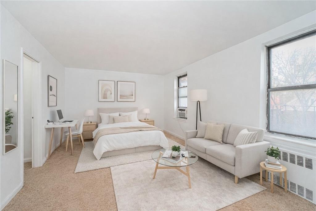 20 89th Street, Unit 3A Brooklyn, NY 11209 - Photo 2 of 18 a spacious bedroom with a bed and a couch