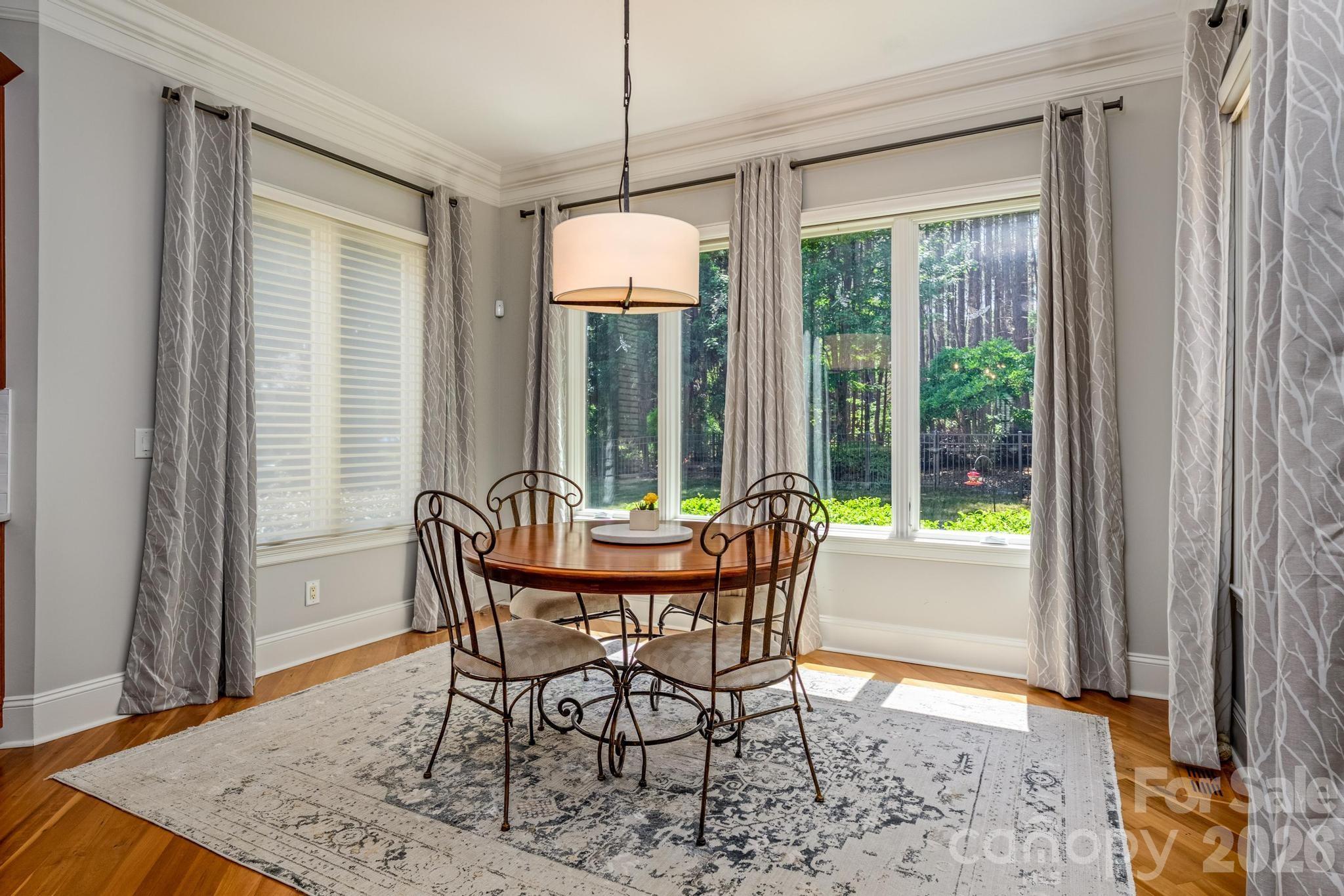 7315 Bay Ridge Drive Denver, NC 28037 - Photo 23 of 39 a dining room with furniture wooden floor and a chandelier