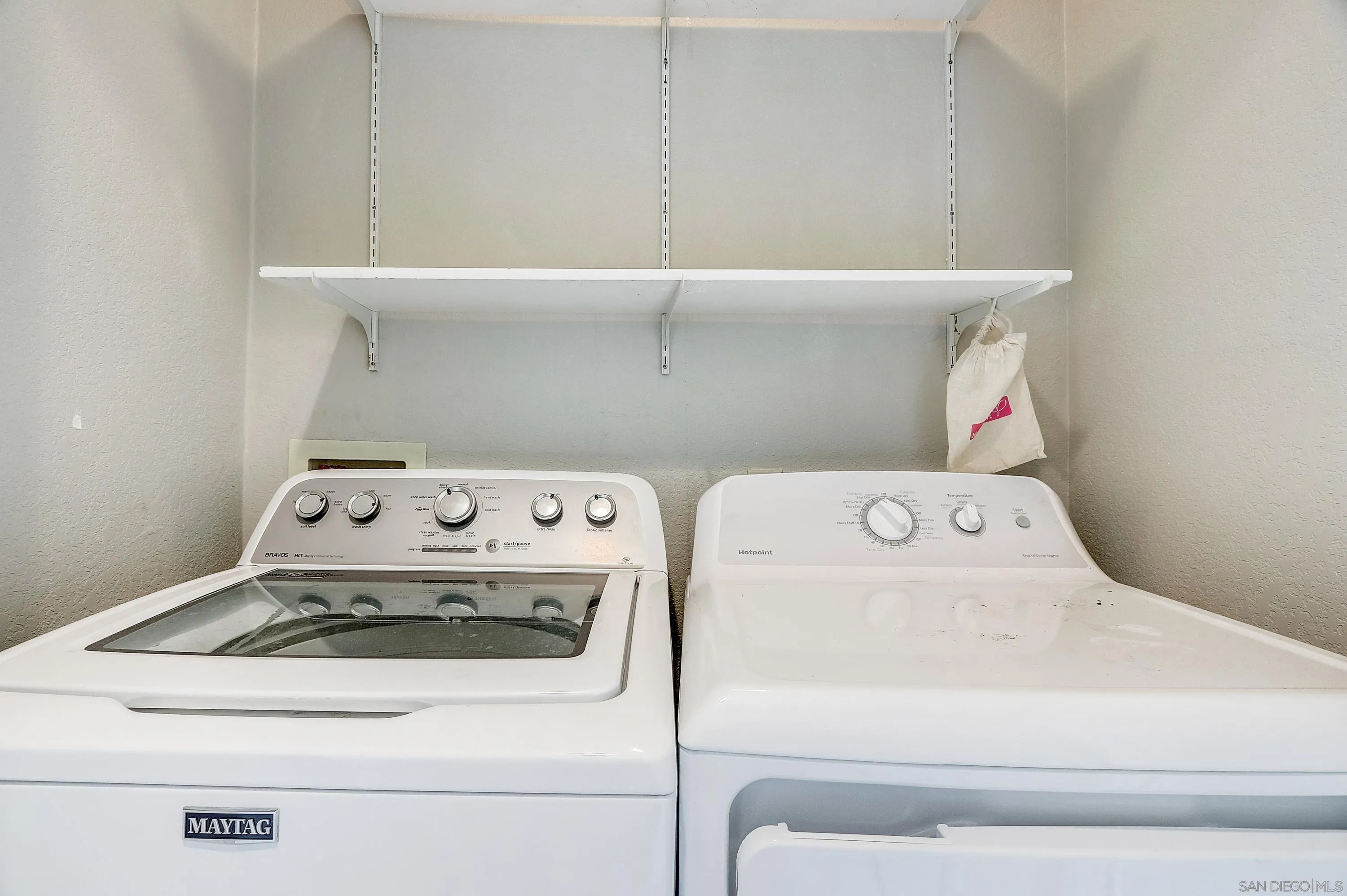 405 Ribbon Beach Way, Unit 249 Oceanside, CA 92058 - Photo 18 of 34 a utility room with dryer and washer