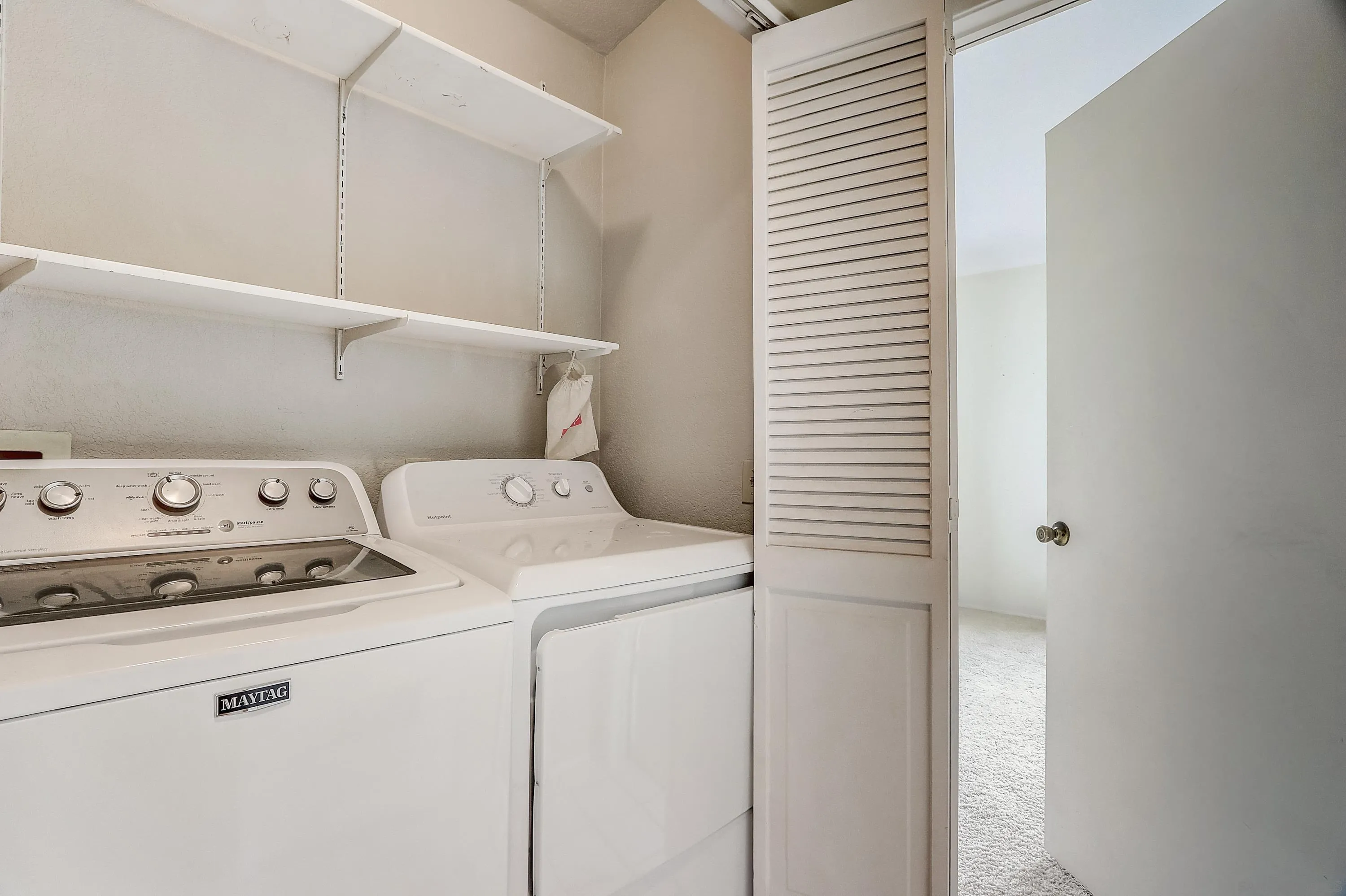 405 Ribbon Beach Way, Unit 249 Oceanside, CA 92058 - Photo 19 of 34 a utility room with dryer and washer