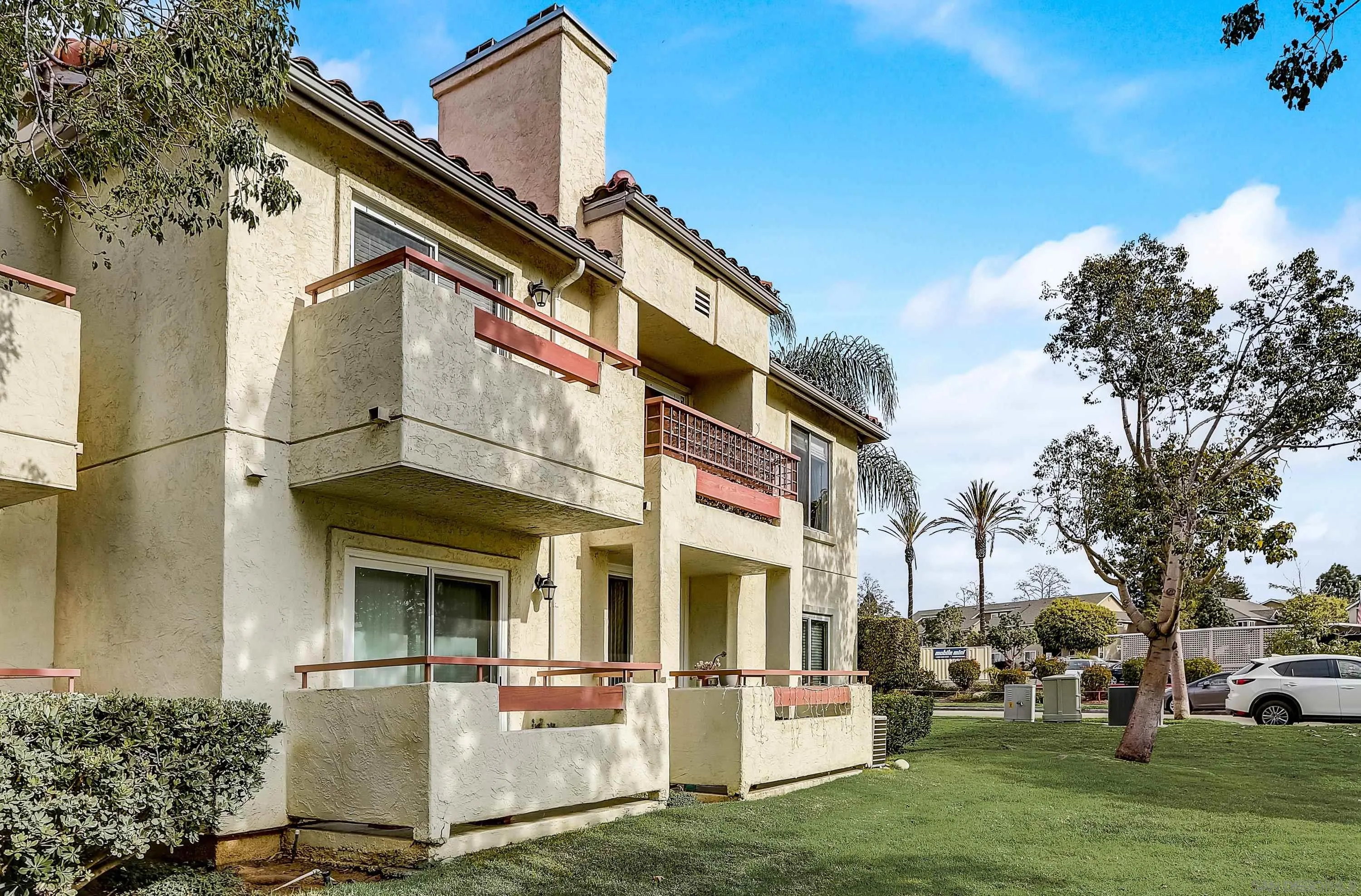 405 Ribbon Beach Way, Unit 249 Oceanside, CA 92058 - Photo 23 of 34 a front view of a building with a garden