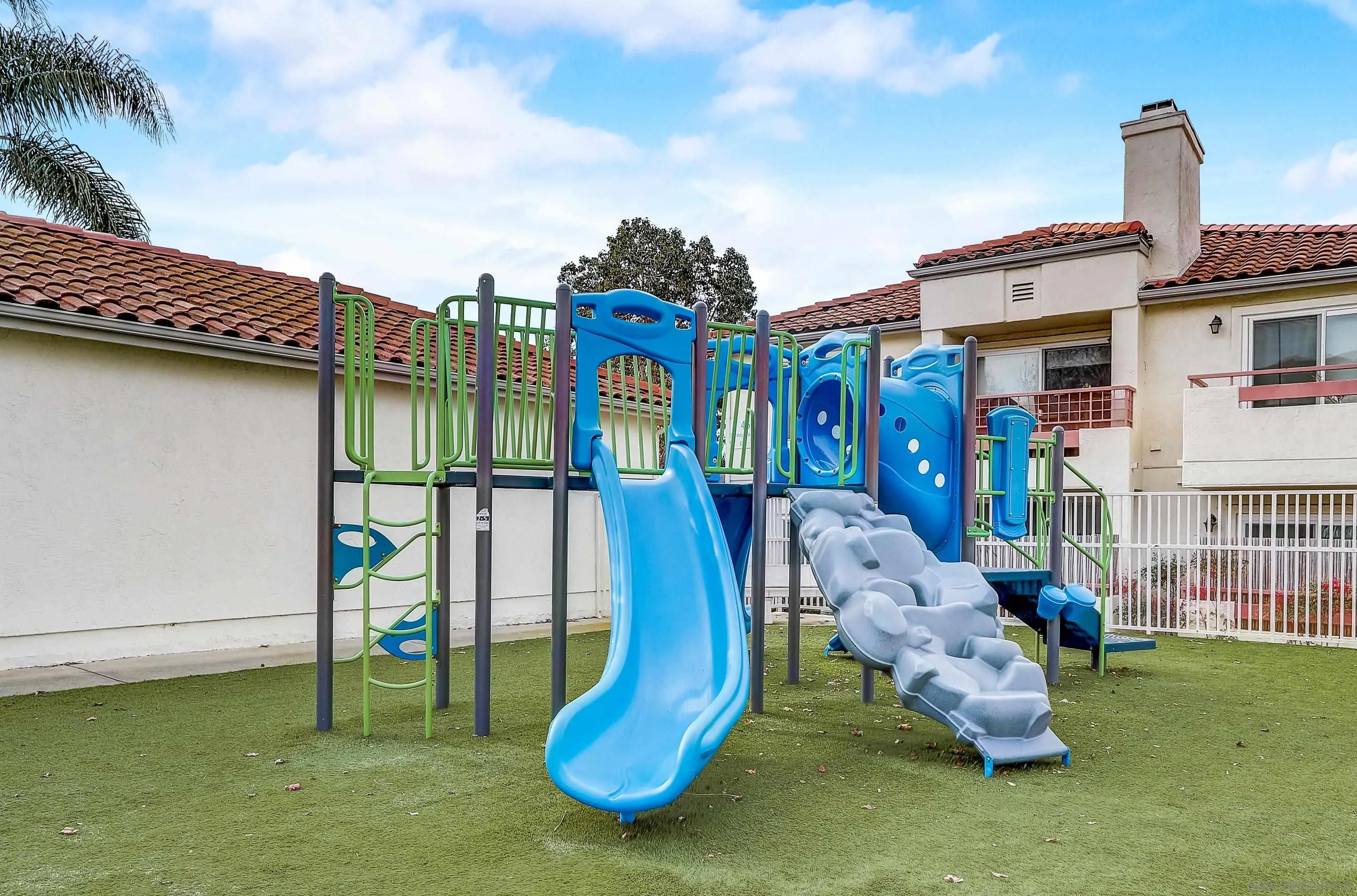 405 Ribbon Beach Way, Unit 249 Oceanside, CA 92058 - Photo 28 of 34 a front view of a house with swimming pool outdoor seating and yard