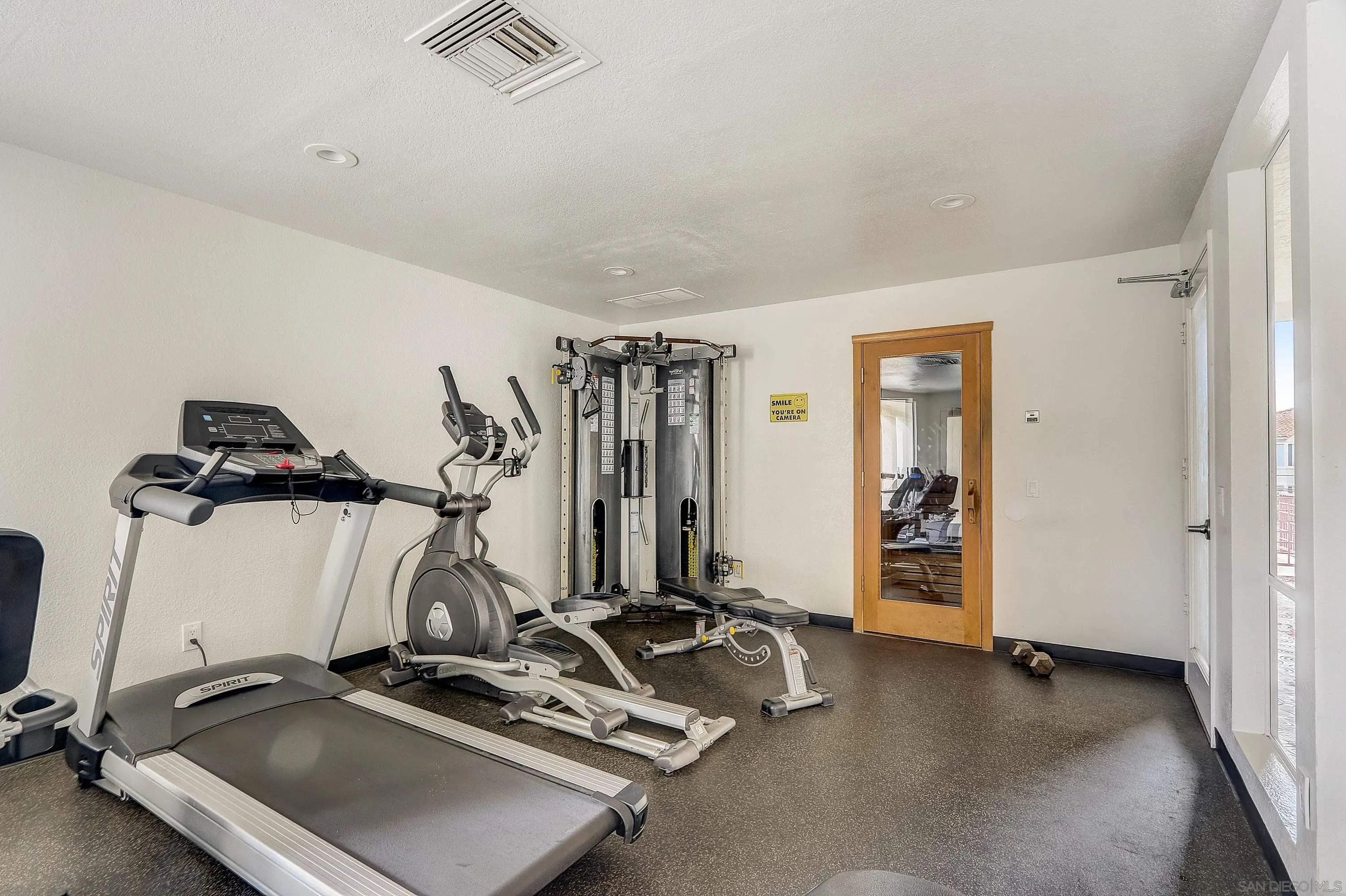 405 Ribbon Beach Way, Unit 249 Oceanside, CA 92058 - Photo 33 of 34 a view of a room with gym equipment