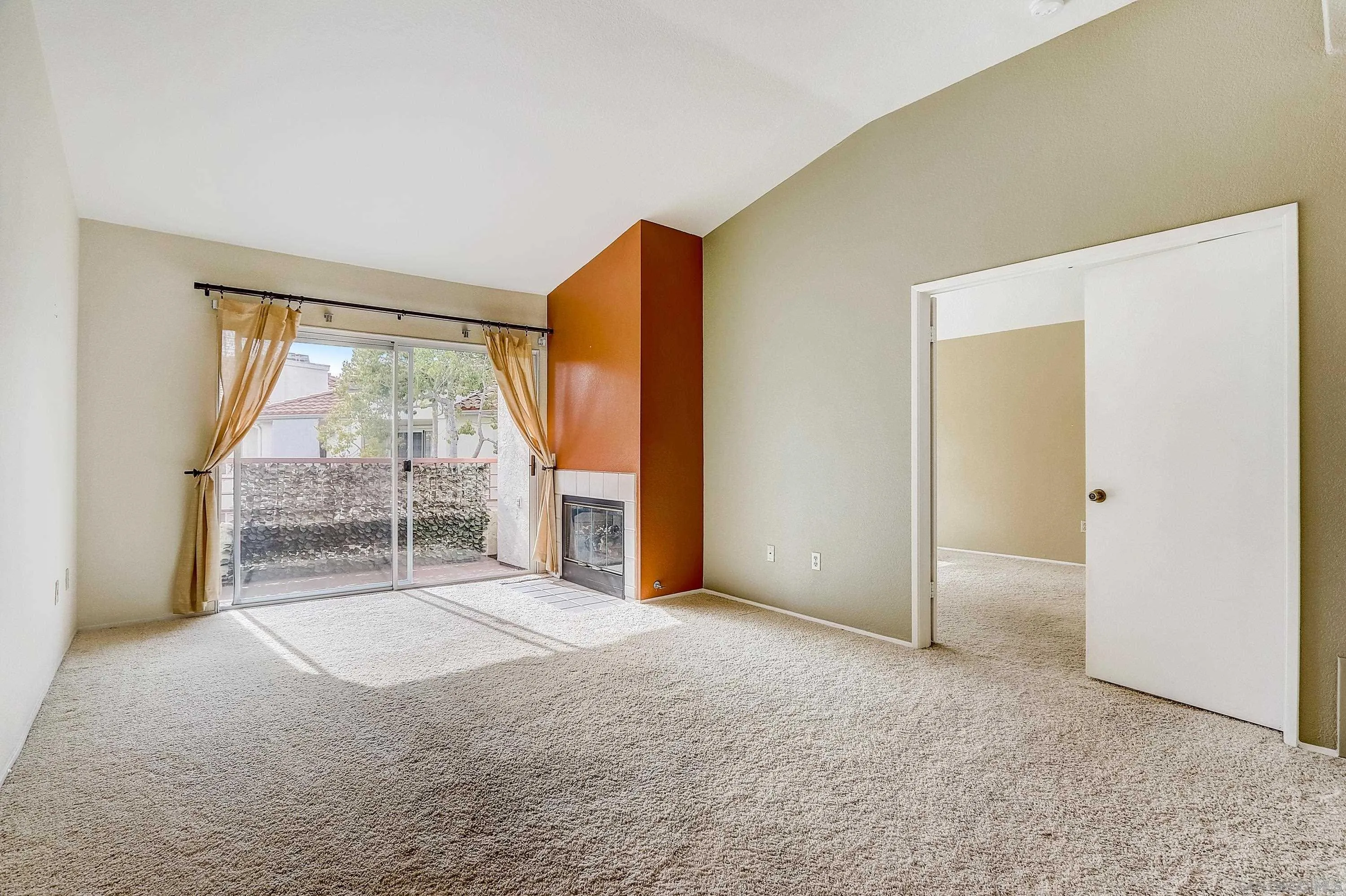 405 Ribbon Beach Way, Unit 249 Oceanside, CA 92058 - Photo 5 of 34 a view of an empty room with glass door and balcony