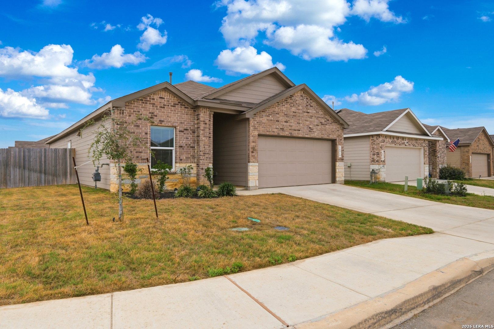 14919 Rhyolite Way Elmendorf, TX 78112 - Photo 1 of 26 a view of a house with basketball court