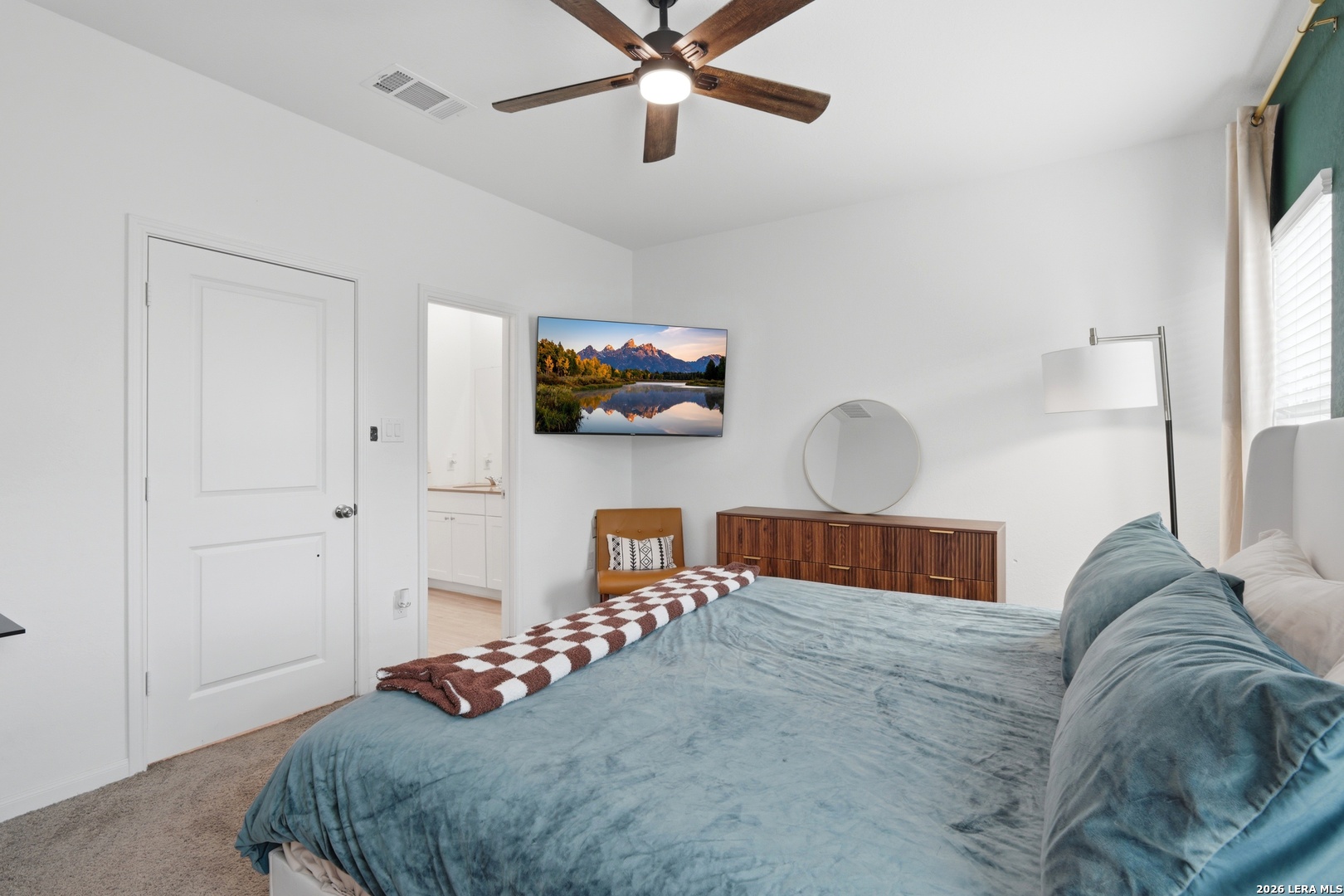 14919 Rhyolite Way Elmendorf, TX 78112 - Photo 13 of 26 a bedroom with a bed and window