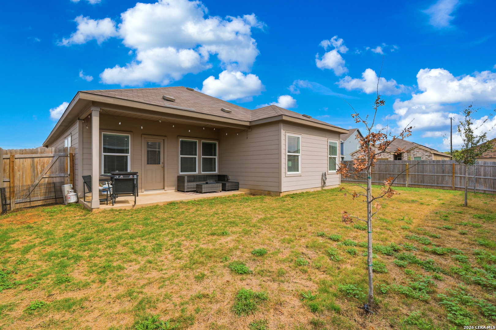 14919 Rhyolite Way Elmendorf, TX 78112 - Photo 20 of 26 a view of a house with a patio