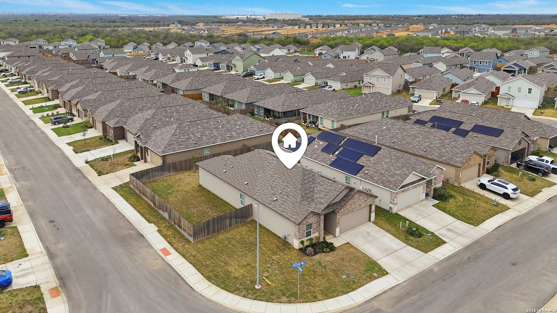 14919 Rhyolite Way Elmendorf, TX 78112 - Photo 22 of 26 an aerial view of residential houses with outdoor space