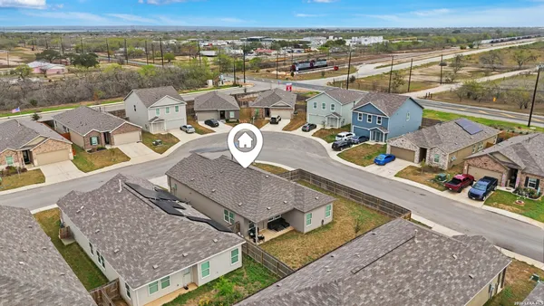 an aerial view of a house with a ocean view