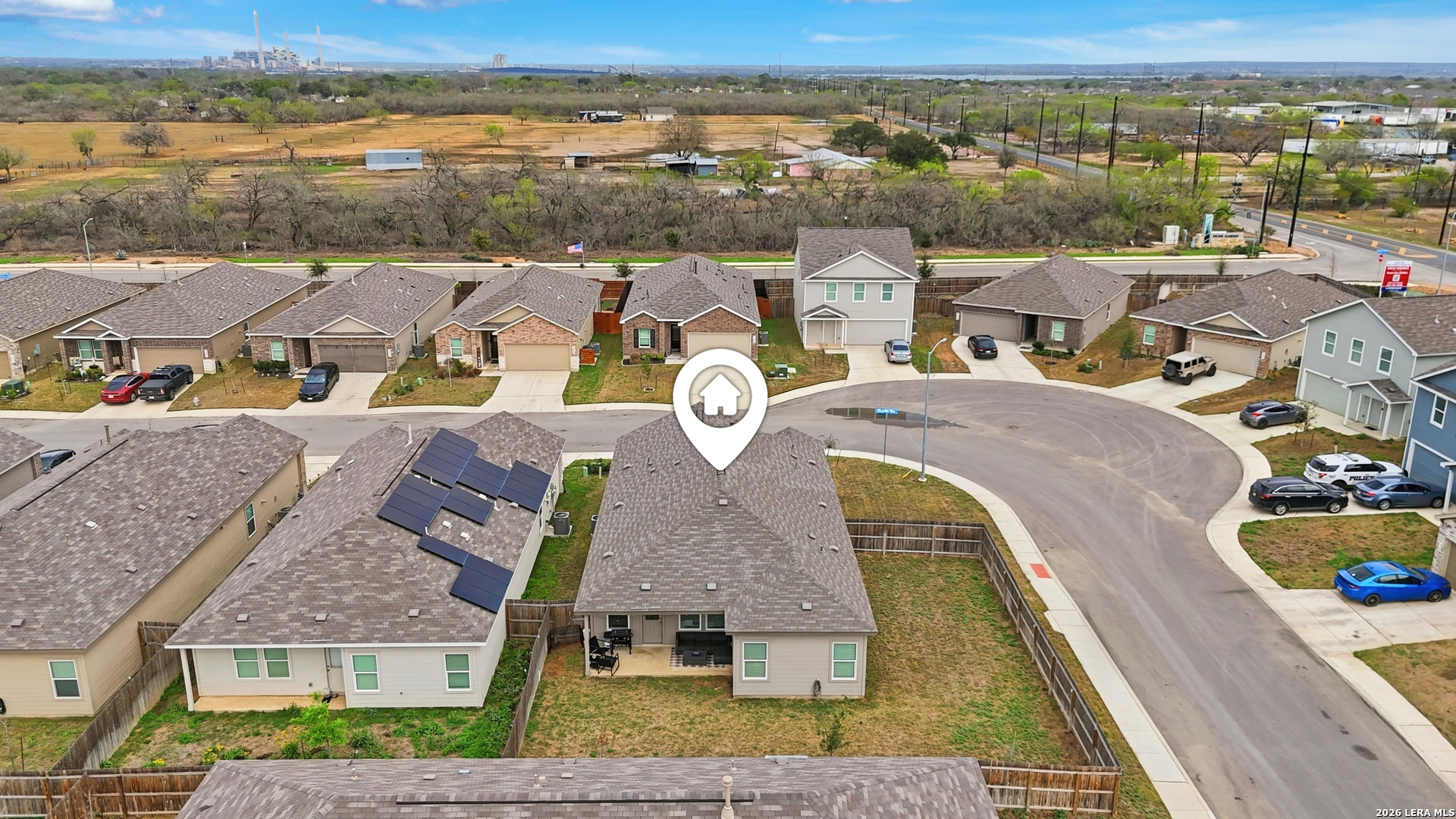 14919 Rhyolite Way Elmendorf, TX 78112 - Photo 24 of 26 an aerial view of residential houses with outdoor space and ocean view