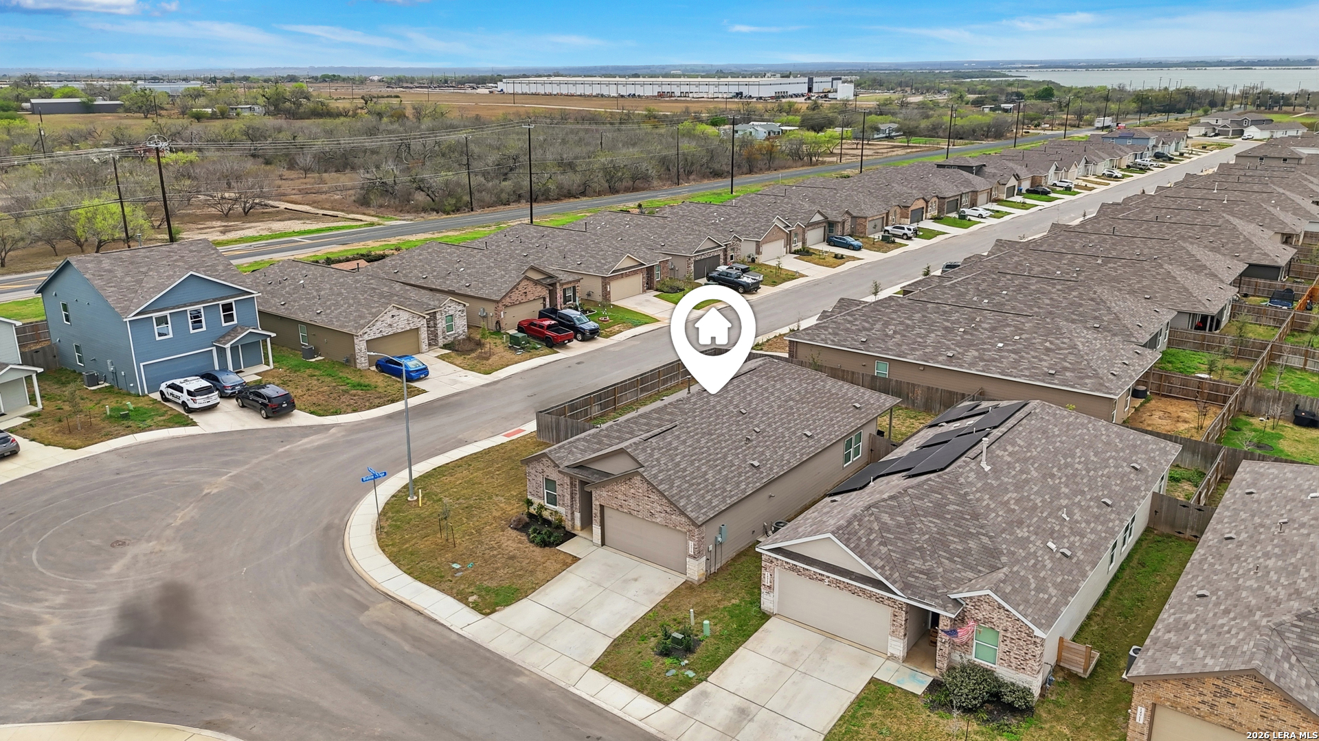14919 Rhyolite Way Elmendorf, TX 78112 - Photo 25 of 26 an aerial view of a house with outdoor space