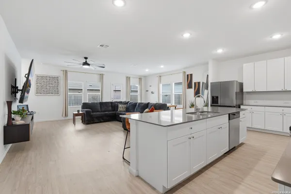 a kitchen with sink and cabinets