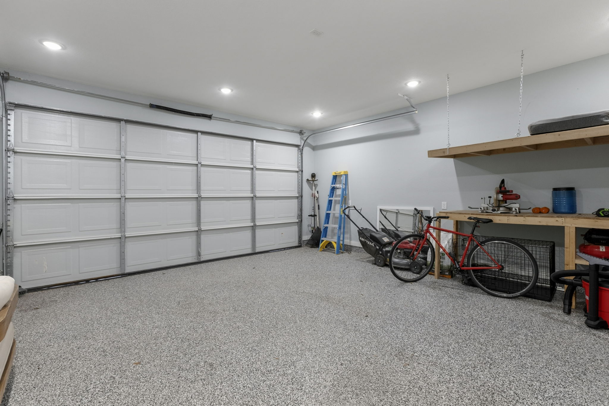 700 South Church Street Lockhart, TX 78644 - Photo 29 of 37 2 car garage with epoxy floors and recess lighting.