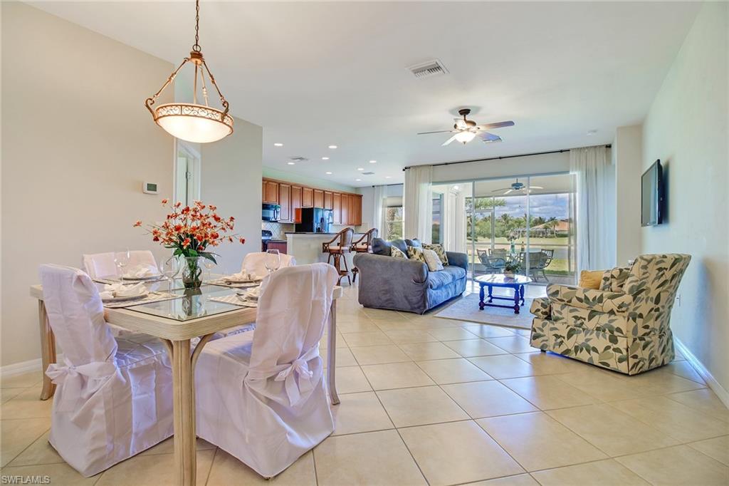 8797 Ravello Court Naples, FL 34114 - Photo 28 of 28 dinning room with living room open floor plan