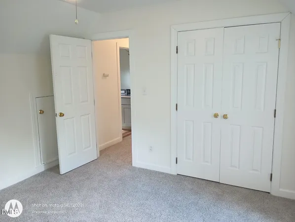 a view of a hallway with closet