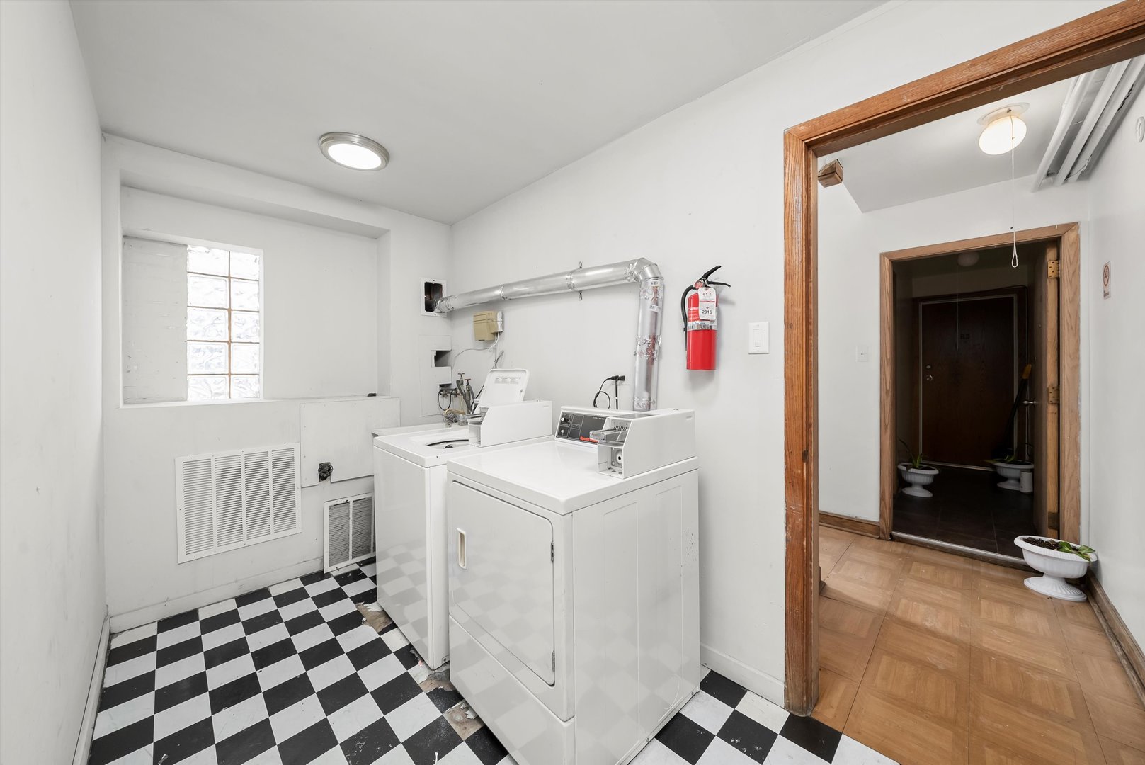 5701 West 55th Street, Unit 1S Chicago, IL 60638 - Photo 13 of 18 a room that has a sink and a mirror in it