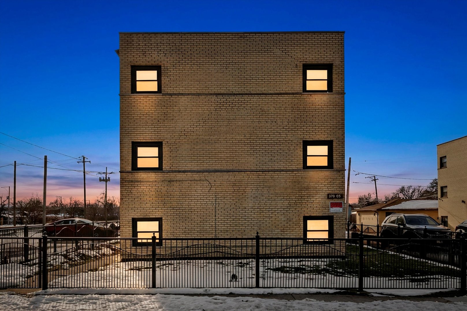 5701 West 55th Street, Unit 1S Chicago, IL 60638 - Photo 18 of 18 a front view of a house with parking area