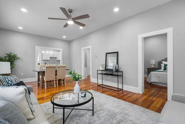 a living room with furniture and a rug
