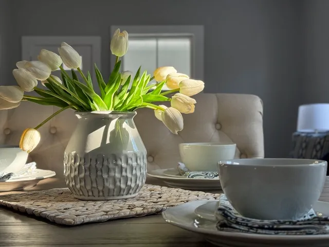 a bathroom with a bathtub sink and mirror