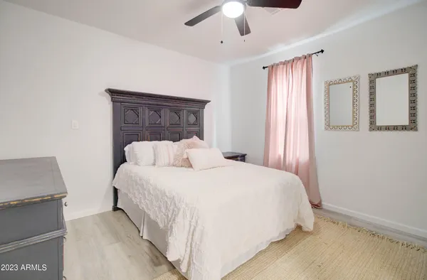 a bedroom with a large bed and a couch