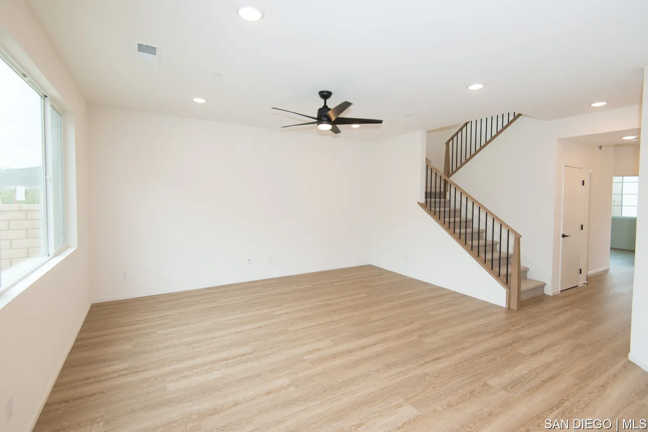 229 Paddock Lane Fallbrook, CA 92028 - Photo 11 of 33 wooden floor in an empty room with a window