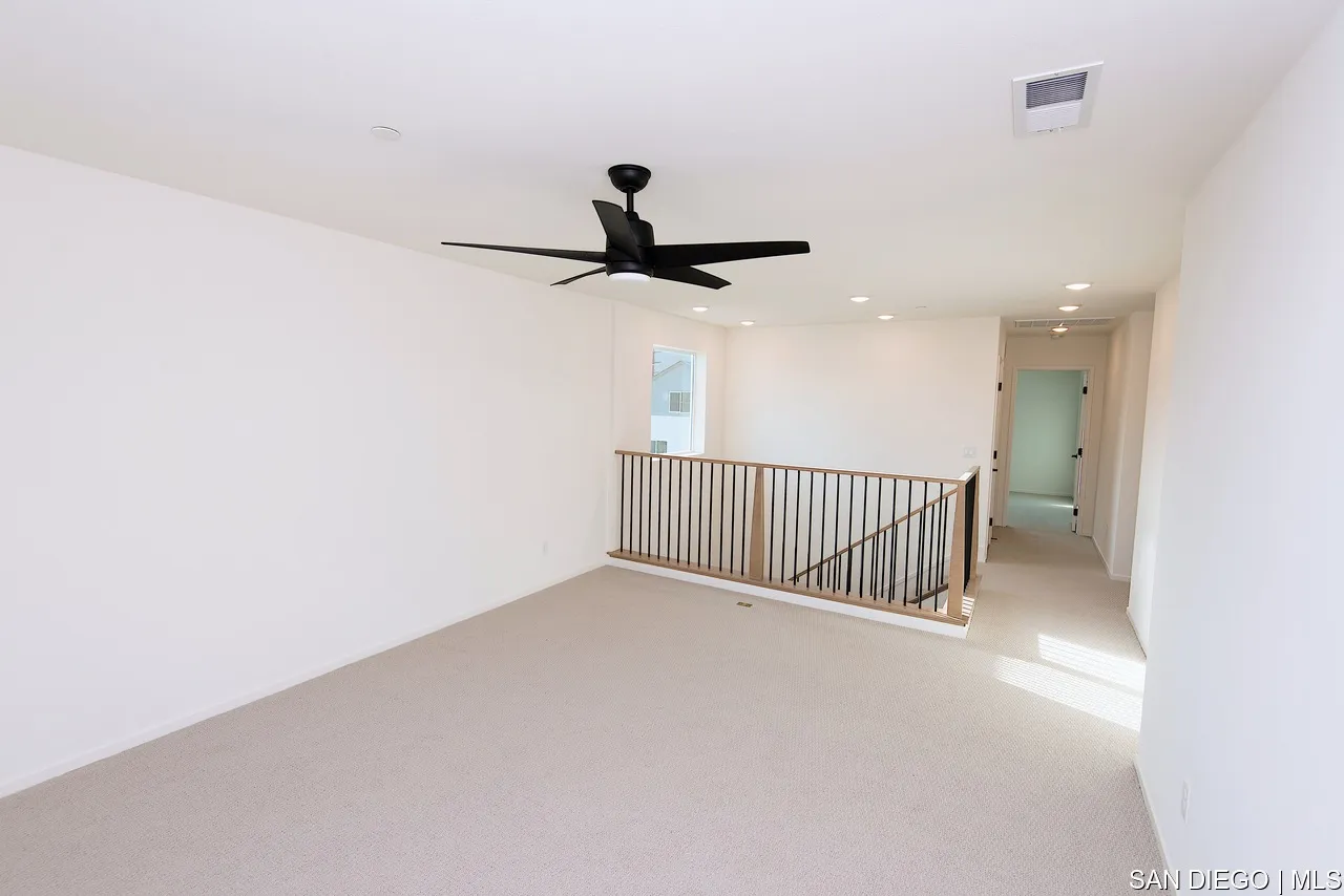 229 Paddock Lane Fallbrook, CA 92028 - Photo 16 of 33 a view of a room with a ceiling fan and window