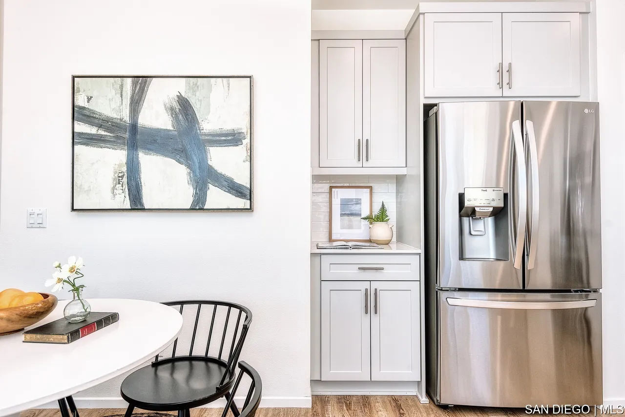 229 Paddock Lane Fallbrook, CA 92028 - Photo 2 of 33 a kitchen with stainless steel appliances a refrigerator and a table