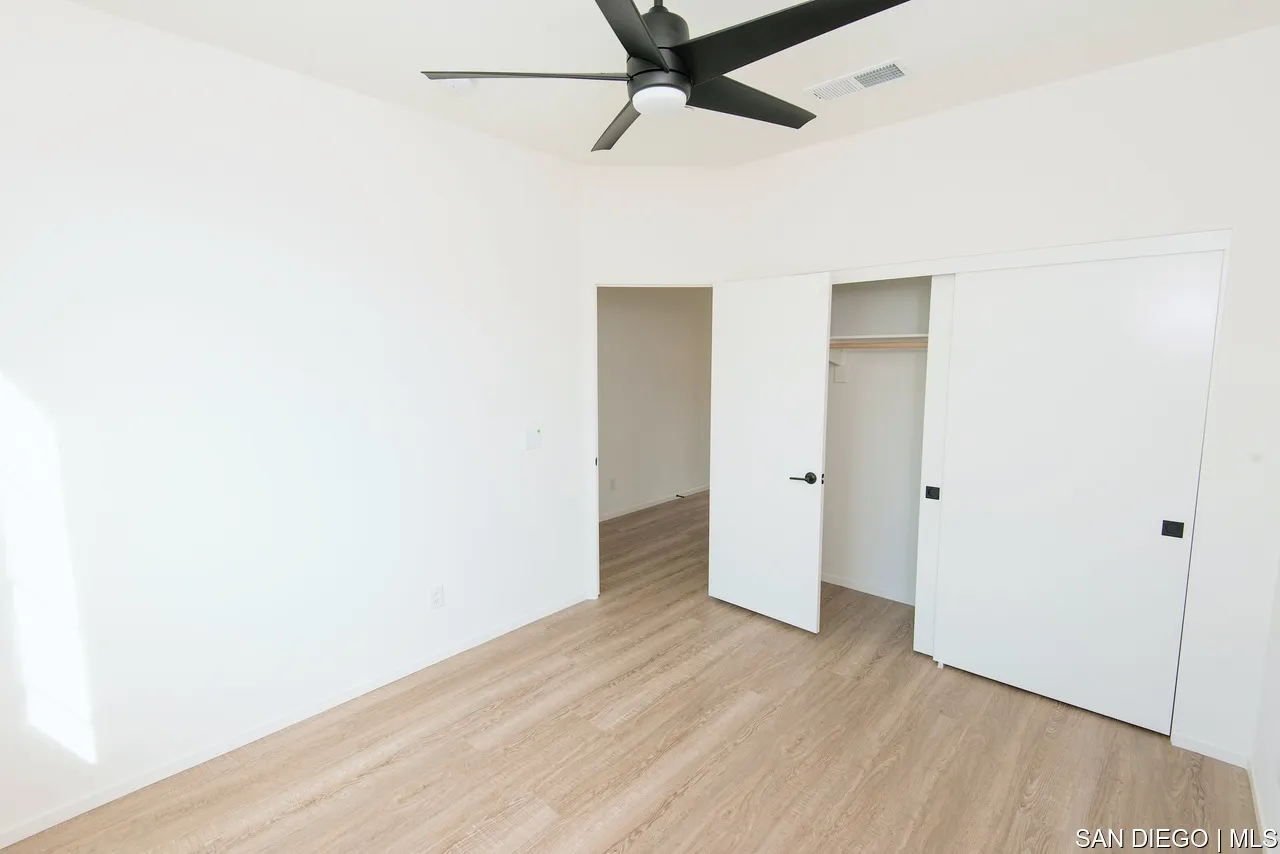 229 Paddock Lane Fallbrook, CA 92028 - Photo 25 of 33 a view of a room with wooden floor and white walls