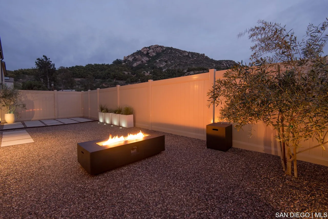 229 Paddock Lane Fallbrook, CA 92028 - Photo 31 of 33 a backyard of a house with table and chairs