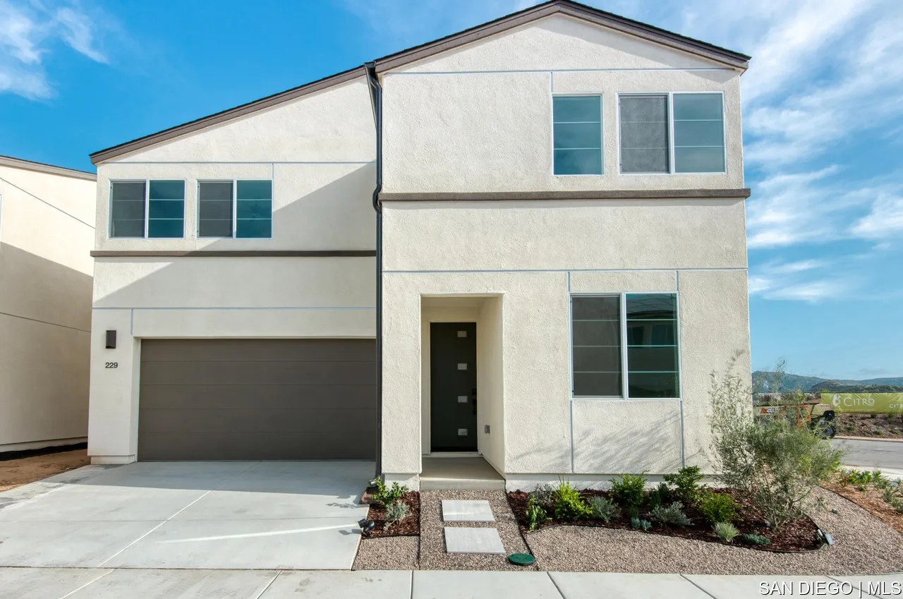 229 Paddock Lane Fallbrook, CA 92028 - Photo 33 of 33 a front view of a house with a yard and garage