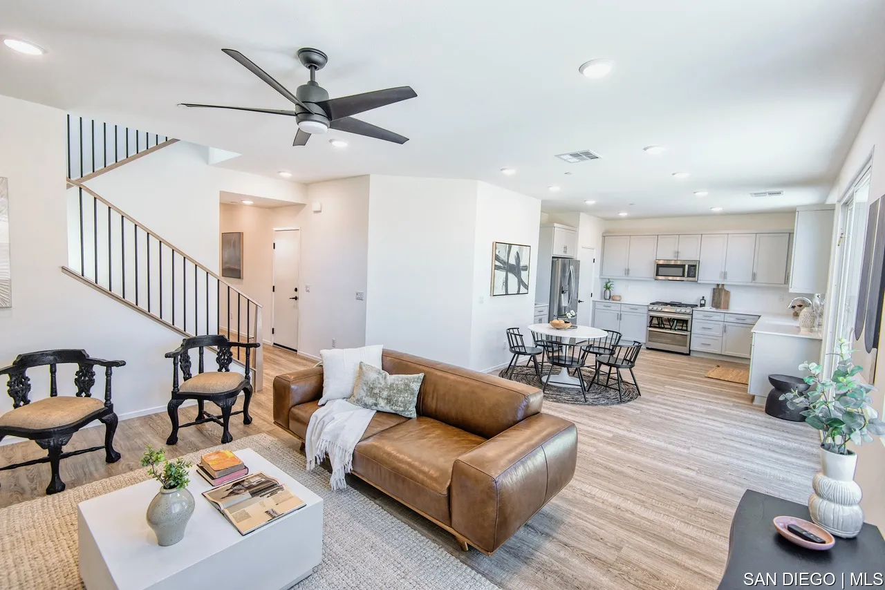 229 Paddock Lane Fallbrook, CA 92028 - Photo 9 of 33 a living room with furniture kitchen view and a chandelier