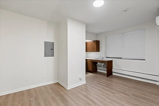 a view of a livingroom with furniture and wooden floor