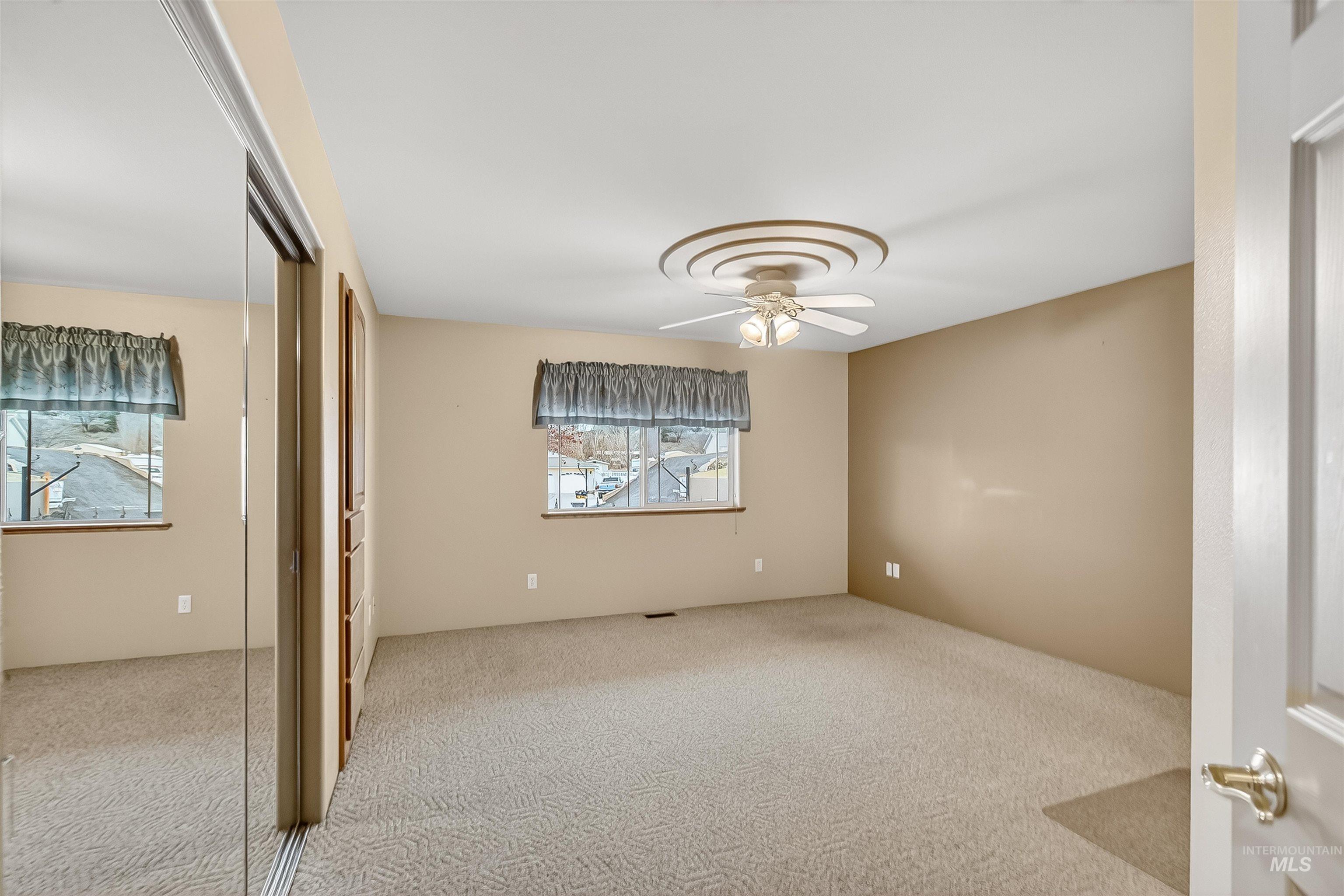 1324 Setlow Court Clarkston, WA 99403 - Photo 20 of 49 Unfurnished bedroom with a closet, carpet flooring, and ceiling fan