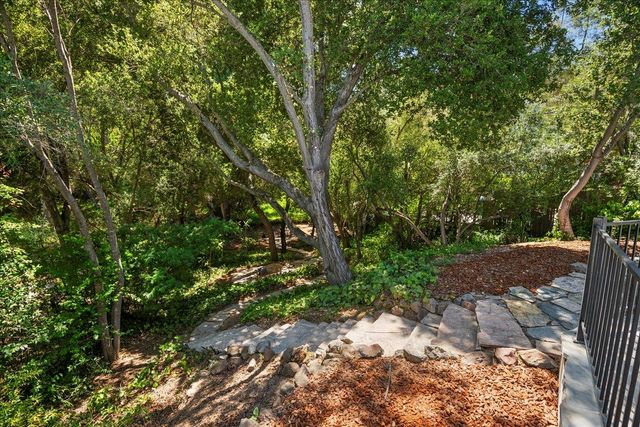a backyard of a house with lots of green space