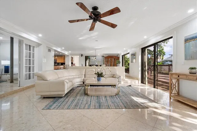 a kitchen with stainless steel appliances granite countertop a stove a sink a oven and a refrigerator