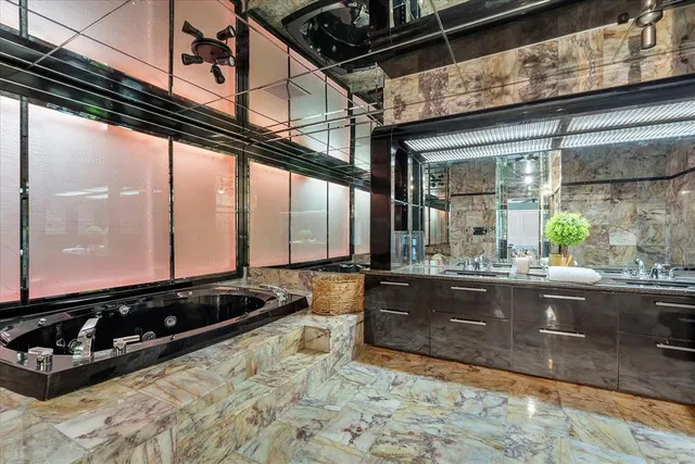 a view of a patio with table and chairs and potted plants