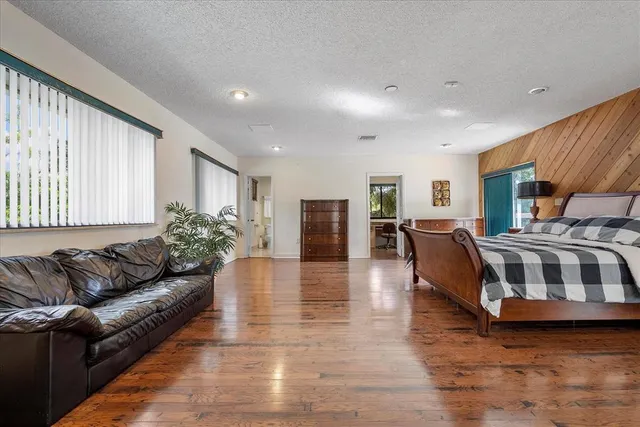 a view of a house with a yard and tree s