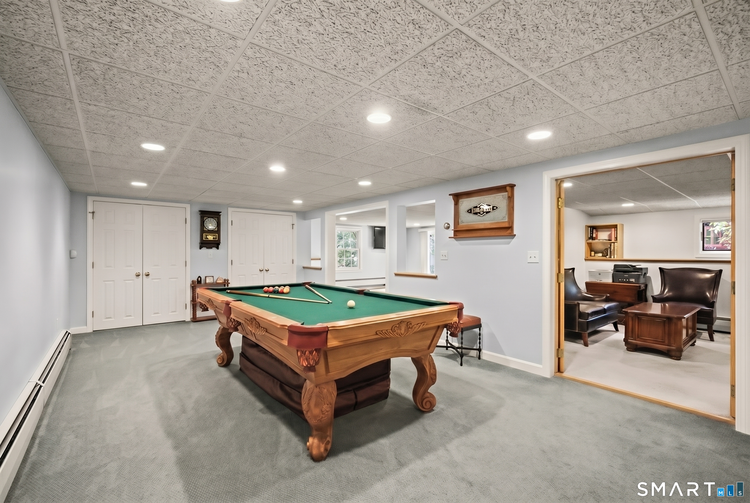 17 Briar Hill Road Avon, CT 06001 - Photo 26 of 38 Lower-level has a pool room, additional family room, office, and the office has access to an exercise area. This level has sliding doors to the lower patio.