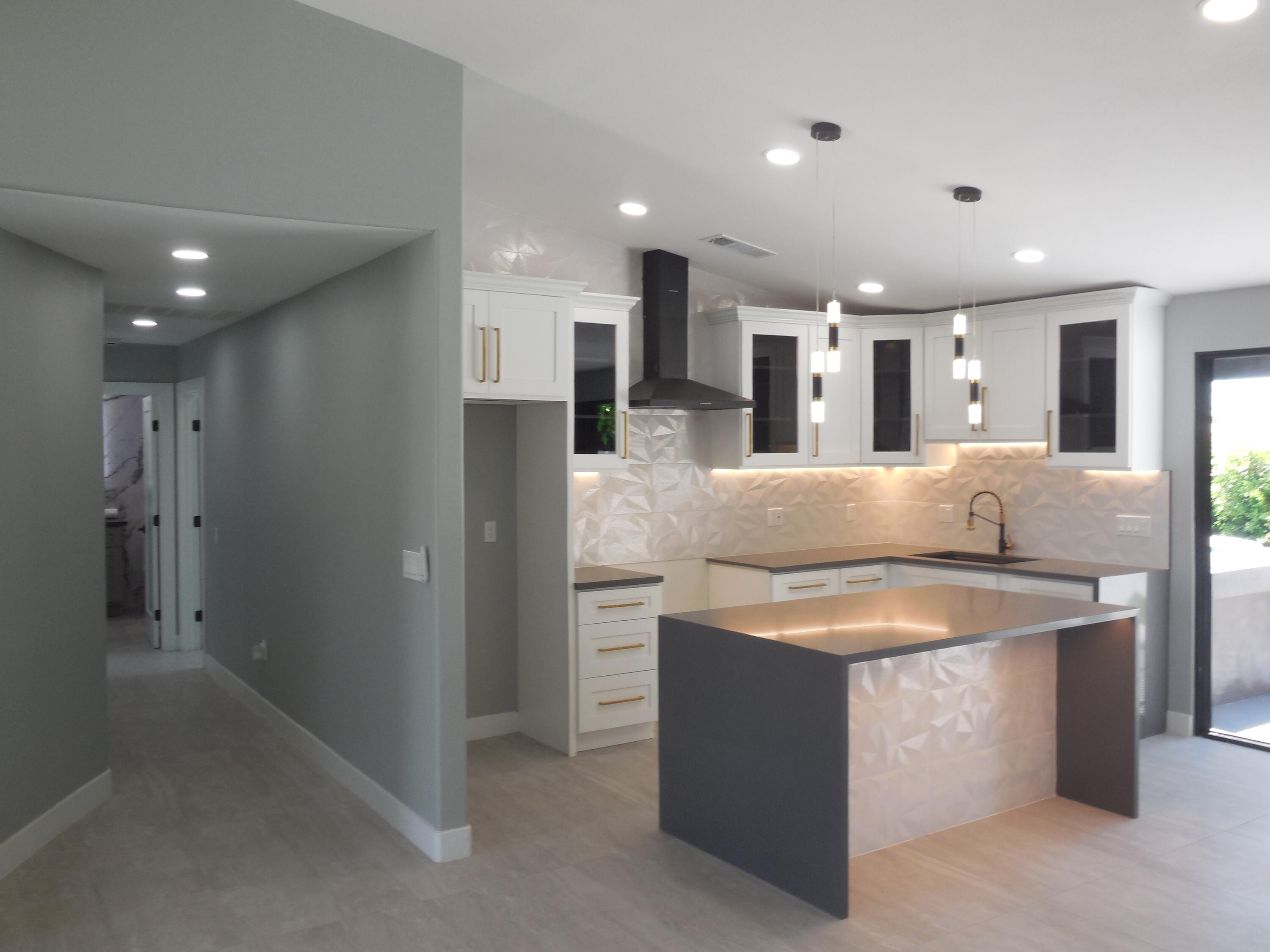 83389 Calypso Circle Indio, CA 92201 - Photo 11 of 45 a large kitchen with stainless steel appliances granite countertop a large counter top and a refrigerator