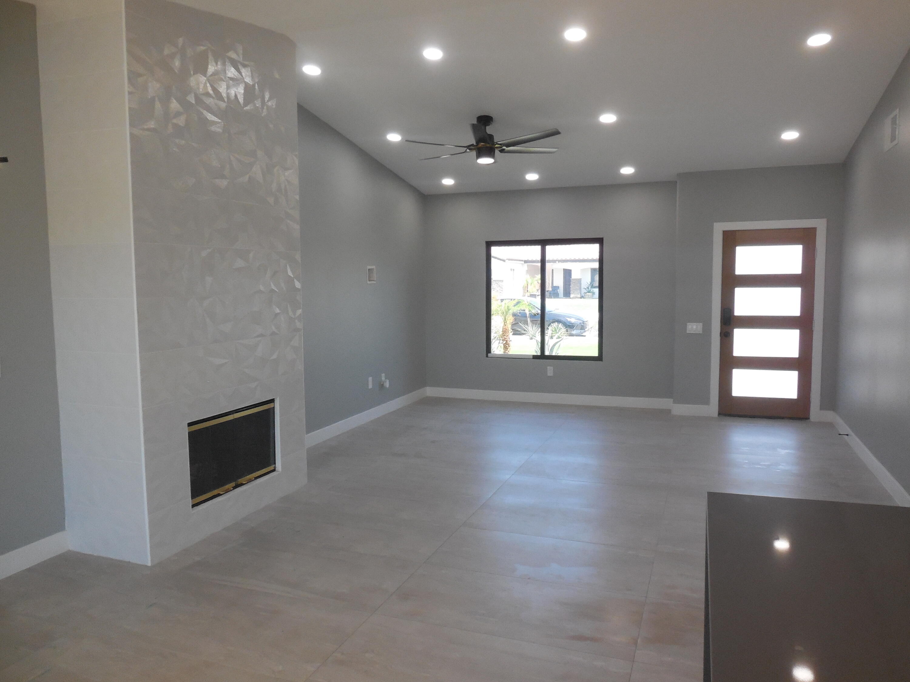 83389 Calypso Circle Indio, CA 92201 - Photo 15 of 45 an empty room with windows and fireplace