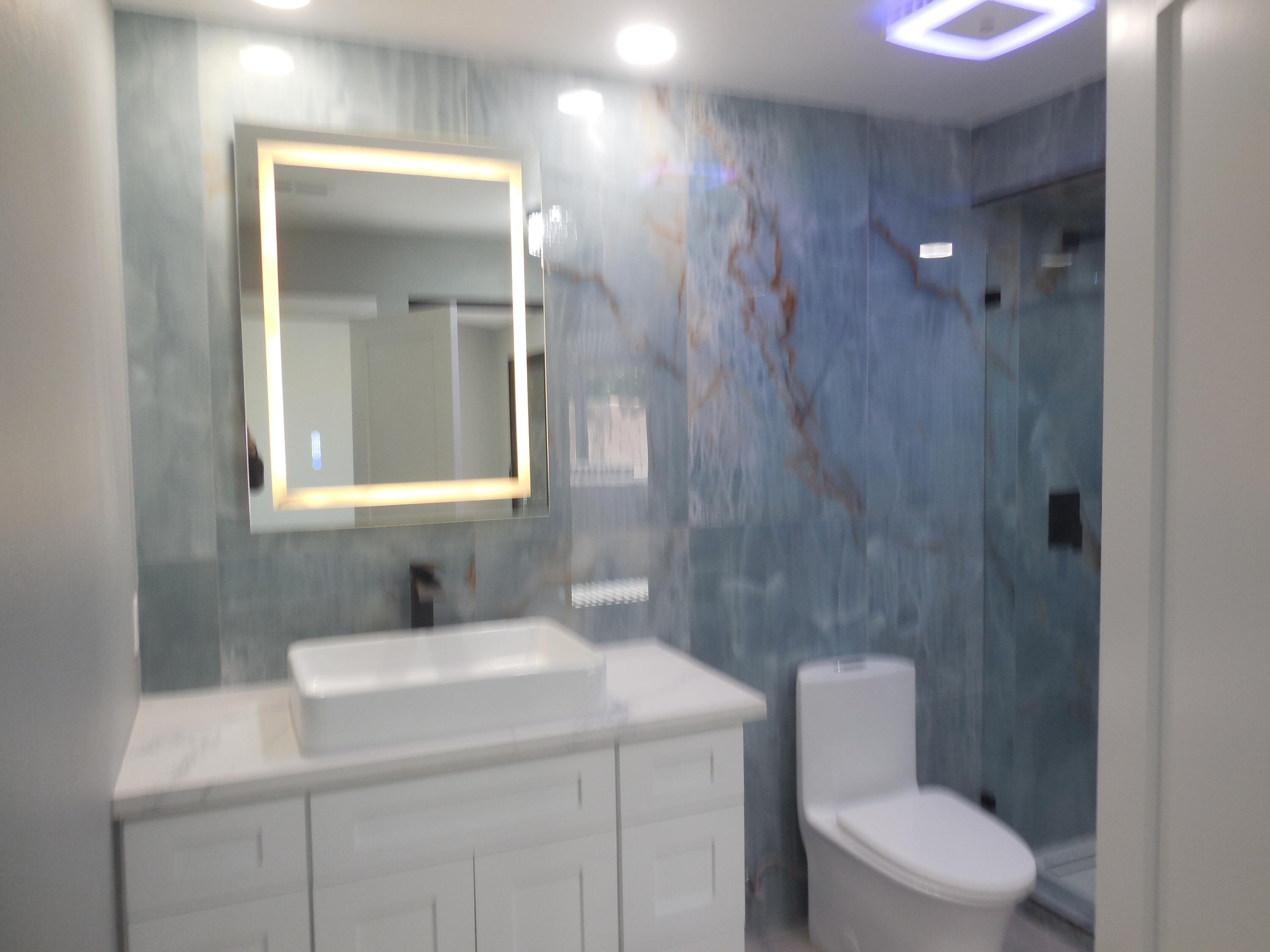 83389 Calypso Circle Indio, CA 92201 - Photo 17 of 45 a bathroom with a toilet sink vanity and mirror